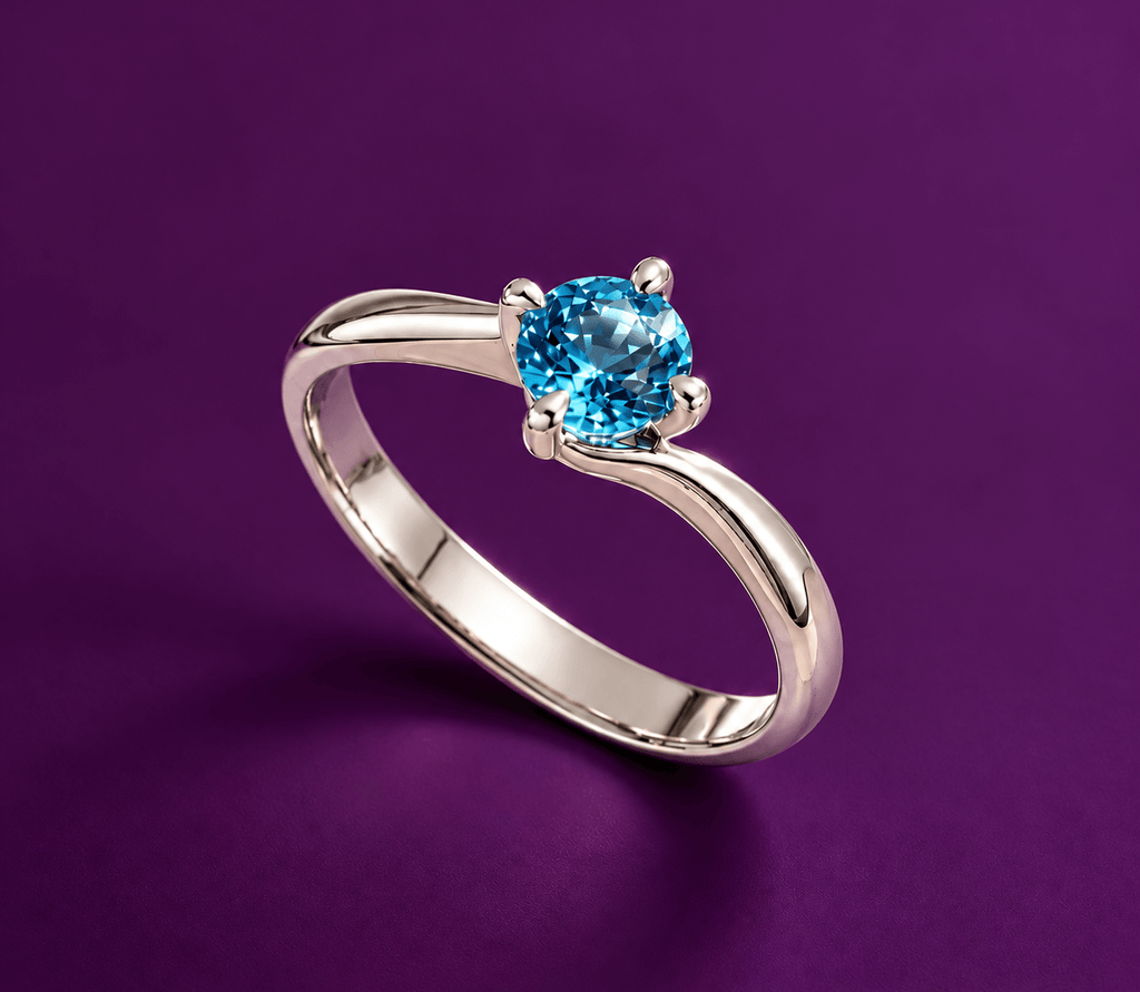 Natural Blue Topaz Solitaire Twist Ring in Sterling Silver by AME Jewellery. 