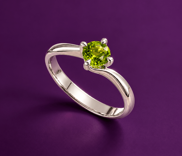 Natural Peridot Solitaire Twist Ring in Sterling Silver by AME Jewellery.