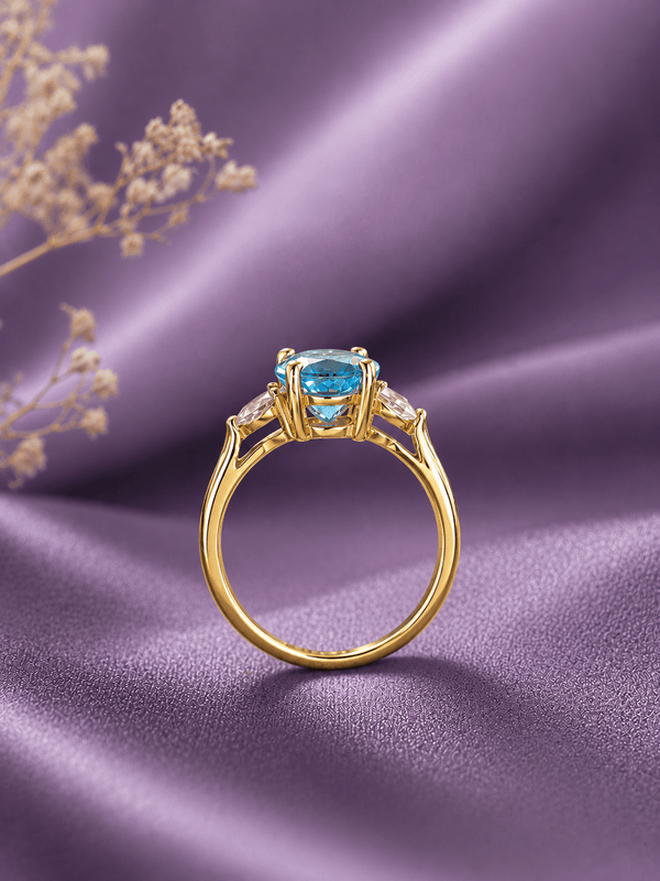 Bague en or jaune 14K et topaze bleue naturelle taille ovale - AME Jewellery.