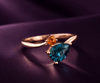 Bague bypass en or rose 14K avec topaze bleue de Londres et saphir orange naturels - AME Jewellery