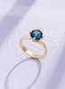 Natural Blue Topaz Twist Solitaire Ring in 14K Yellow Gold by AME Jewellery.
