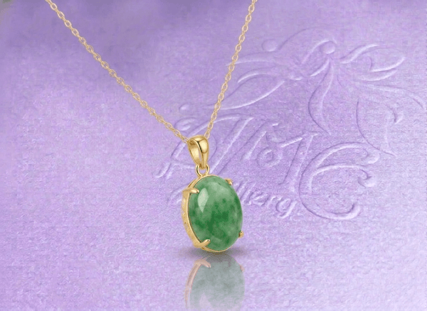Experience timeless elegance with this exquisite jadeite pendant necklace, crafted in 14-karat yellow gold by AME Jewellery.