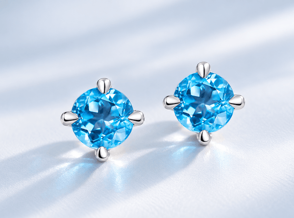 Natural Blue Topaz 4-prong Earrings in Sterling Silver by AME Jewellery. 