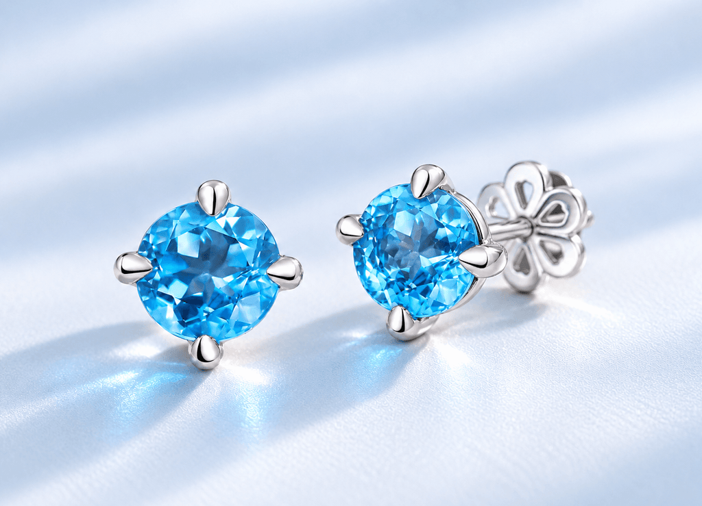 Natural Blue Topaz 4-prong Earrings in Sterling Silver by AME Jewellery. 