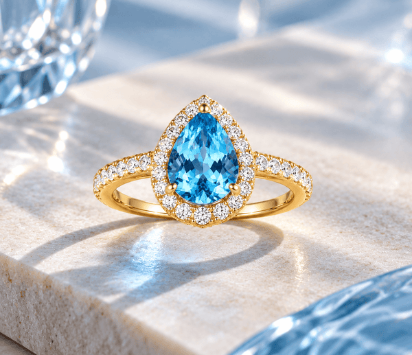 Natural pear-shaped blue topaz ring in 14K yellow gold - AME Jewellery
