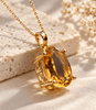 Collier pendentif en or jaune 14K avec citrine ovale naturelle par AME Jewellery.