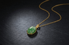 Découvrez l’élégance intemporelle avec cette pendentif en jadeite naturelle, minutieusement façonnée en or jaune 14 carats par AME Jewellery