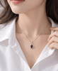 Pendentif halo en grenat rouge naturel ovale en argent de 8 × 6 mm  - AME Jewellery.