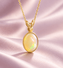 Collier pendentif lunette en or jaune 14K avec opale orange naturelle cabochon ovale par AME Jewellery.