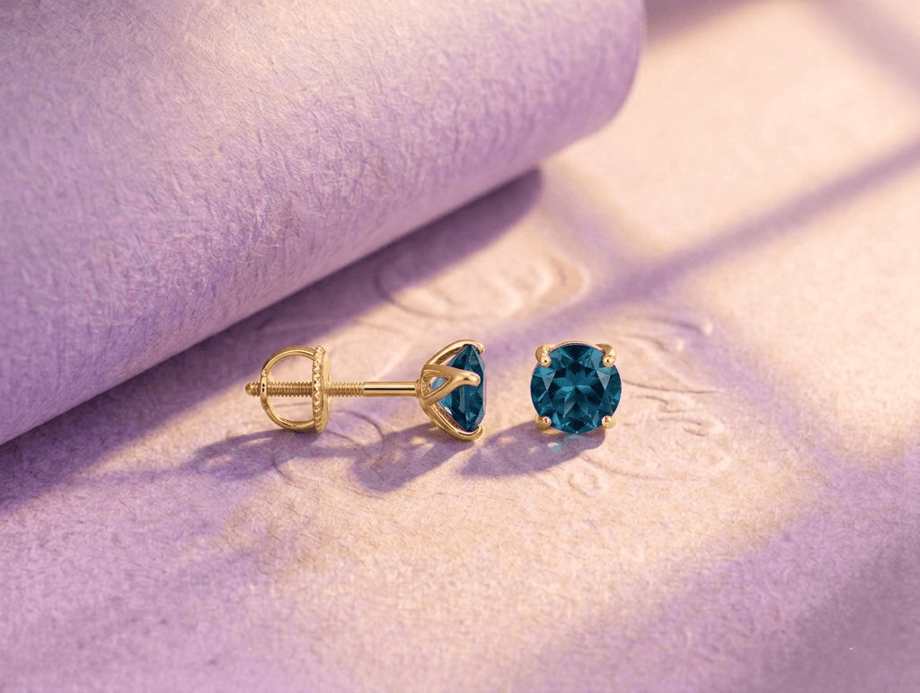 Natural London Blue Topaz 4-Prong Earrings in 14K Yellow Gold by AME Jewellery.