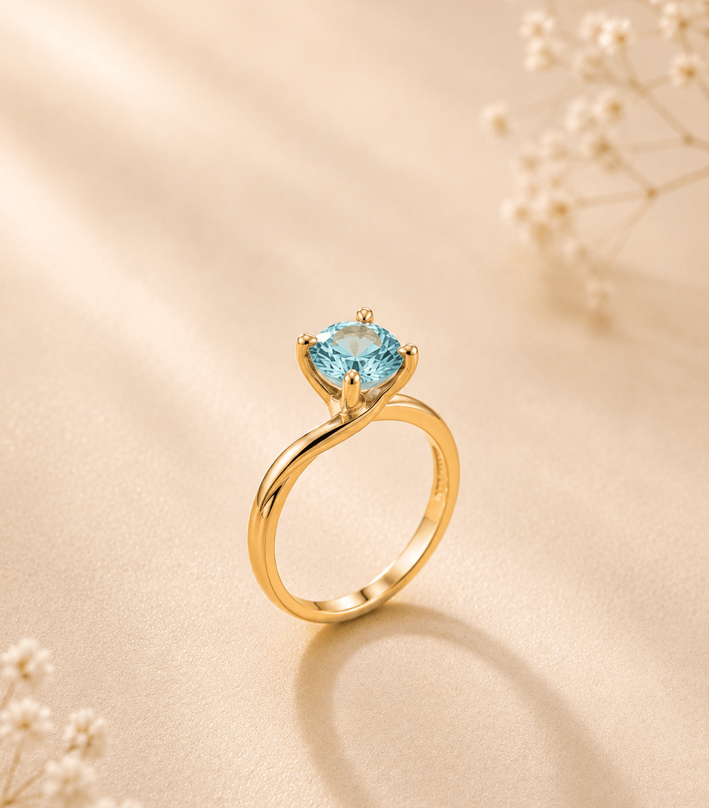 Blue Zircon Twist Solitaire Ring in 14K Yellow Gold - AME Jewellery