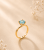 Blue Zircon Twist Solitaire Ring in 14K Yellow Gold - AME Jewellery