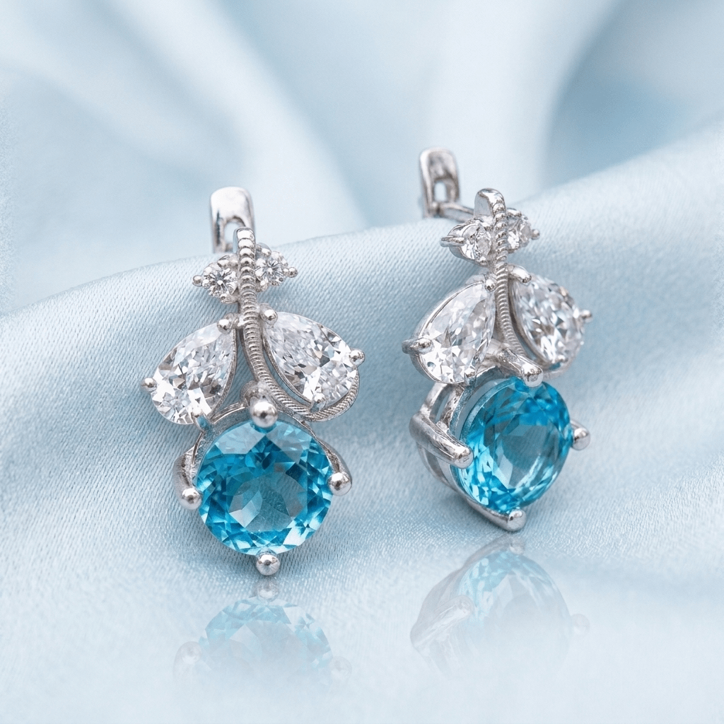 Natural Blue Topaz Leaf Latch-back Earrings in Sterling Silver by AME Jewellery.