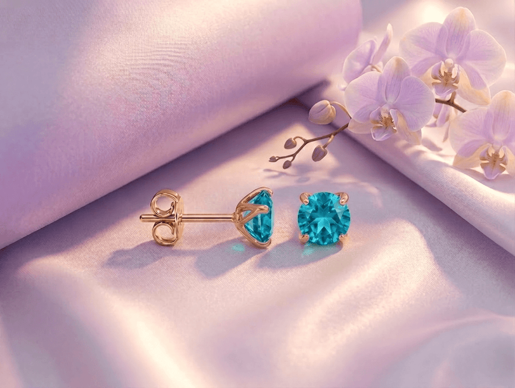 5mm Natural Blue Topaz 4-Prong Earrings in 14K Yellow Gold by AME Jewellery.