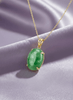 Experience timeless elegance with this exquisite jadeite pendant necklace, crafted in 14-karat yellow gold by AME Jewellery.