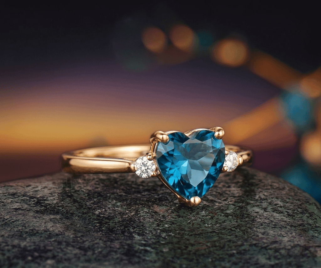 Natural Heart-cut London Blue Topaz Ring in 14K Yellow Gold by AME Jewellery.