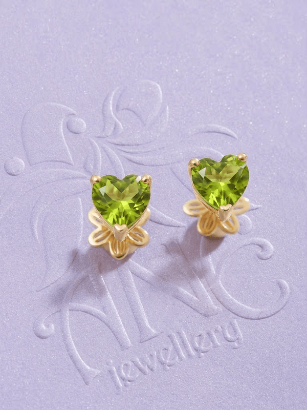 Natural Heart-cut Peridot Earrings in 14-karat Yellow Gold by AME Jewellery.