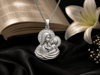  this exquisite pendant depicts the timeless image of the Madonna and Child — the Blessed Virgin Mary lovingly holding the Child Jesus.