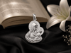  this exquisite pendant depicts the timeless image of the Madonna and Child — the Blessed Virgin Mary lovingly holding the Child Jesus.