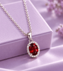 Natural oval Red Garnet Halo Pendant Necklace in Sterling Silver by AME Jewellery.