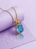 Pendentif nœud papillon en topaze bleue naturelle en or jaune 14K – AME Jewellery