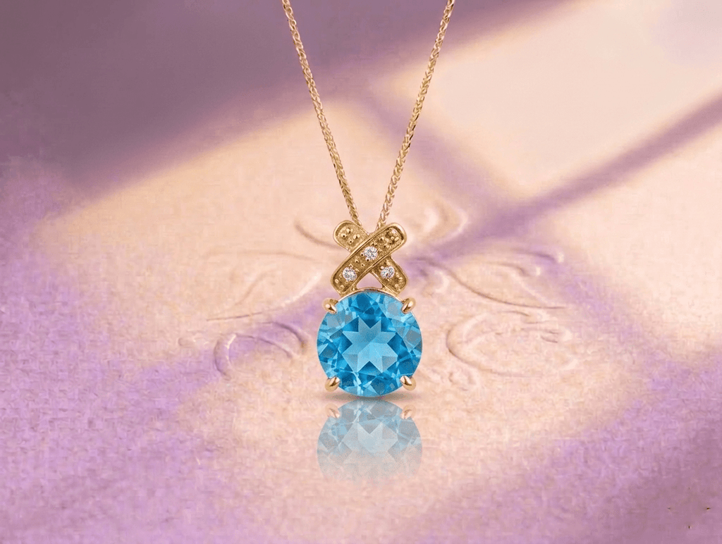 Pendentif nœud papillon en topaze bleue naturelle en or jaune 14K – AME Jewellery