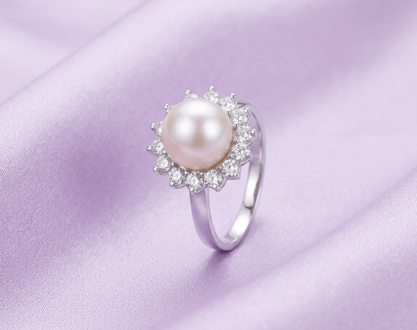 White Freshwater Pearl Sunflower Ring in Sterling Silver by AME Jewellery. Pearl is the birthstone for June and the gemstone for the 3rd and 30th wedding anniversaries.