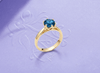 Natural Blue Topaz Twist Ring in 14K Yellow Gold by AME Jewellery.