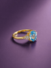 Natural Oval-cut Blue Topaz Ring in 14K Yellow Gold by AME Jewellery.