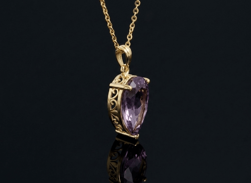 Discover the captivating beauty and elegance of the Natural Pear-cut Ametrine Pendant Necklace, crafted in 14K yellow gold by AME Jewellery. 