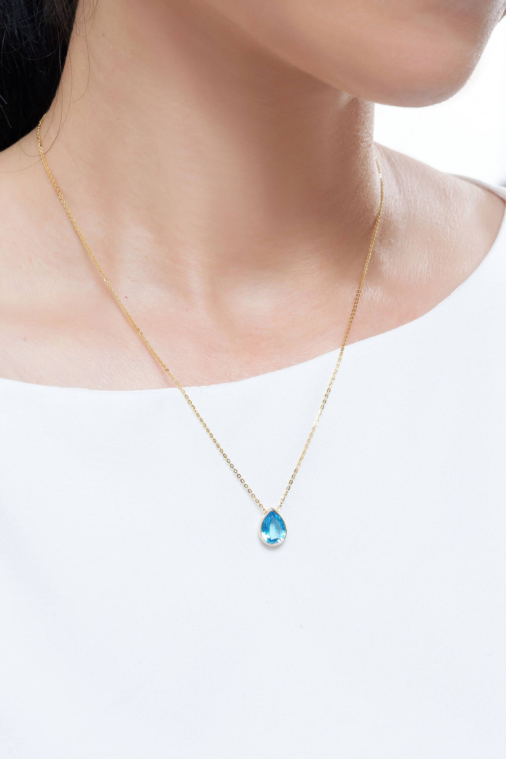 Mặt dây Đá quý thiên nhiên Pear-cut Blue Topaz Bezel Pendant in 14K Yellow Gold by AME Jewellery