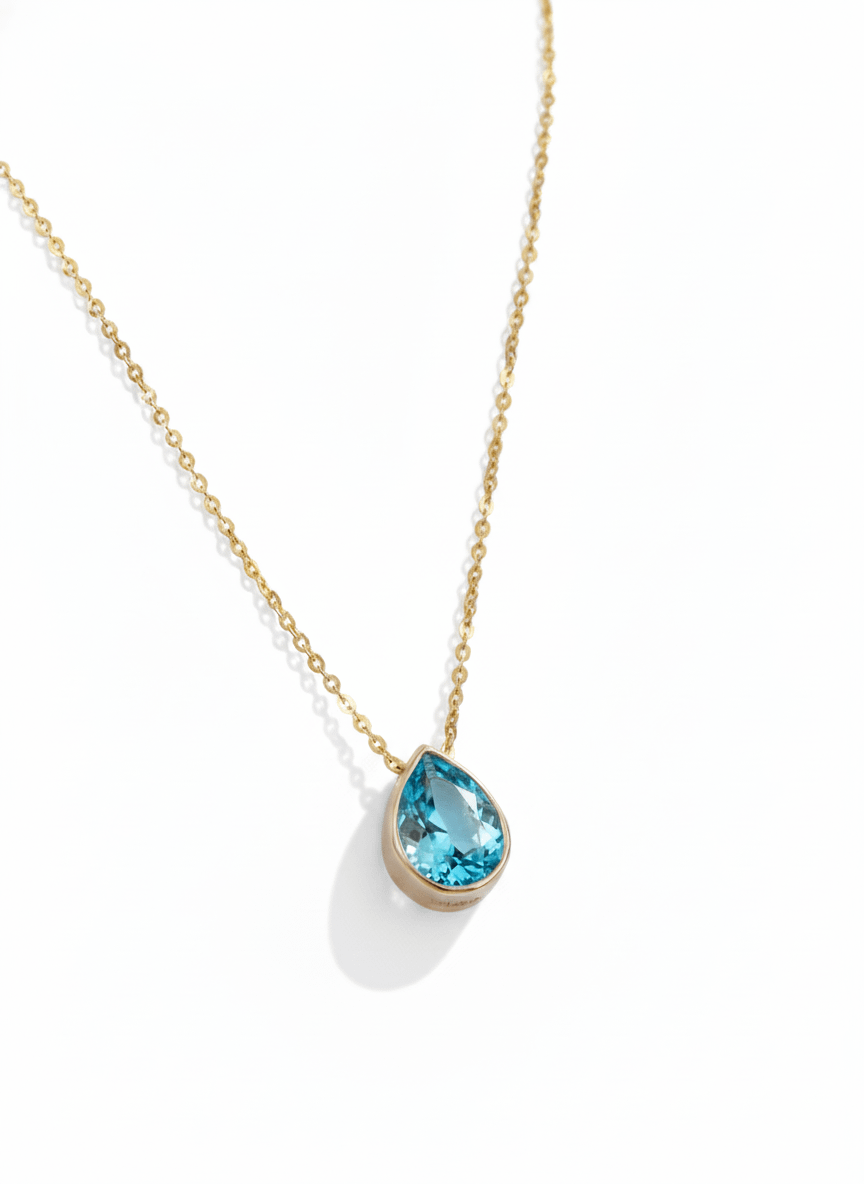 Mặt dây Đá quý thiên nhiên Pear-cut Blue Topaz Bezel Pendant in 14K Yellow Gold by AME Jewellery