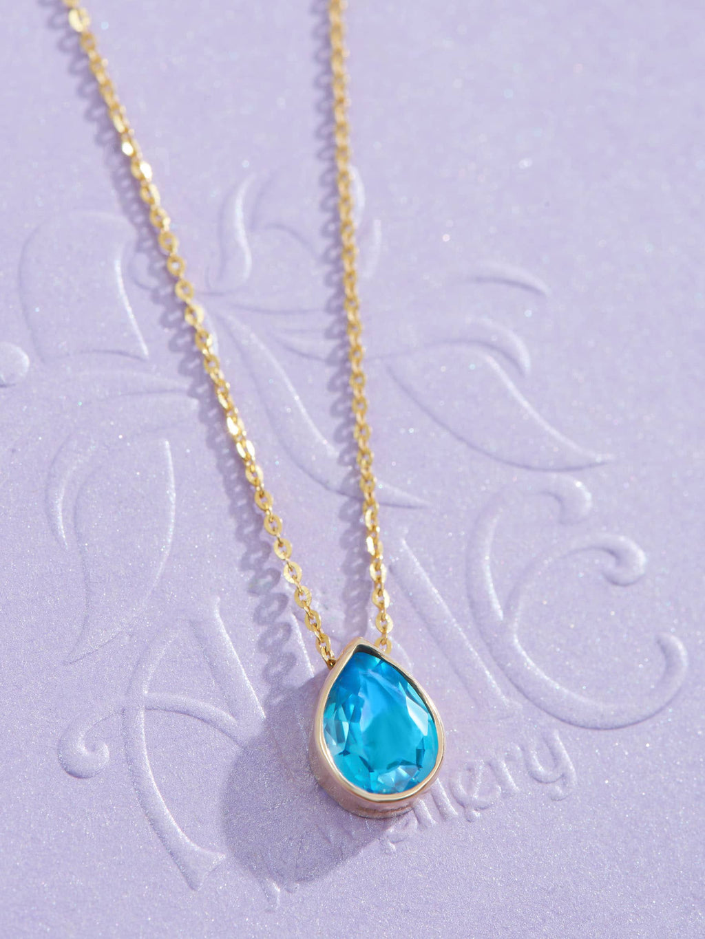 pear-blue-topaz-gold-pendant-pg1217-1