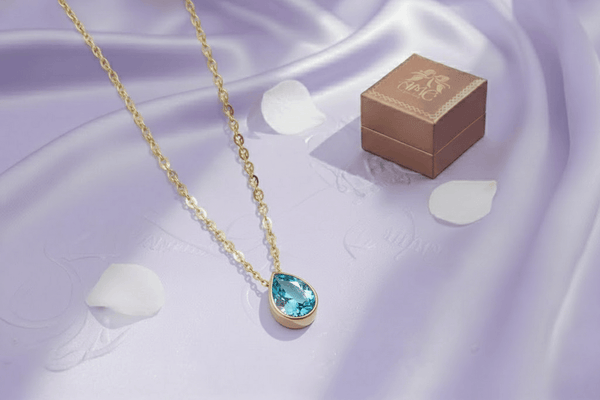 Mặt dây Đá quý thiên nhiên Pear-cut Blue Topaz Bezel Pendant in 14K Yellow Gold by AME Jewellery