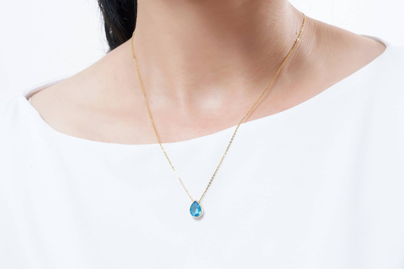 Mặt dây Đá quý thiên nhiên Pear-cut Blue Topaz Bezel Pendant in 14K Yellow Gold by AME Jewellery