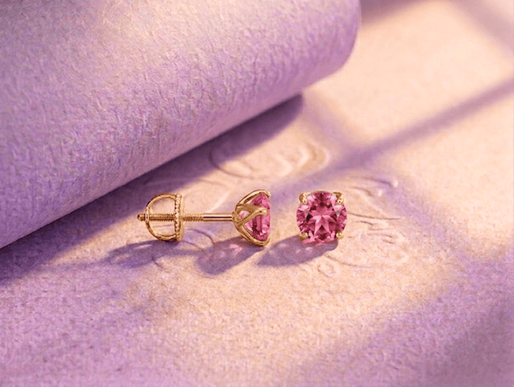 Natural pink topaz 4-prong earrings in 14K yellow gold by AME Jewellery.