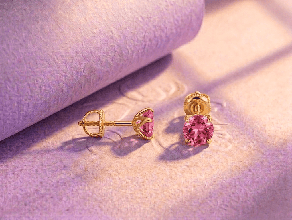 Natural pink topaz 4-prong earrings in 14K yellow gold by AME Jewellery.