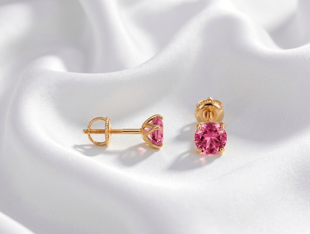 Natural pink topaz 4-prong earrings in 14K yellow gold by AME Jewellery.