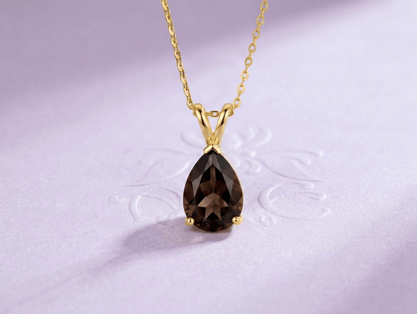 Natural Pear-shaped Smoky Quartz Pendant Necklace in 14K Yellow Gold for Women. Its grounding and stabilizing effects make it a great choice for those looking to bring balance to their lives.