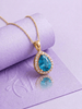 Pendentif en or jaune 14K et topaze bleue naturelle taille en poire – AME Jewellery.