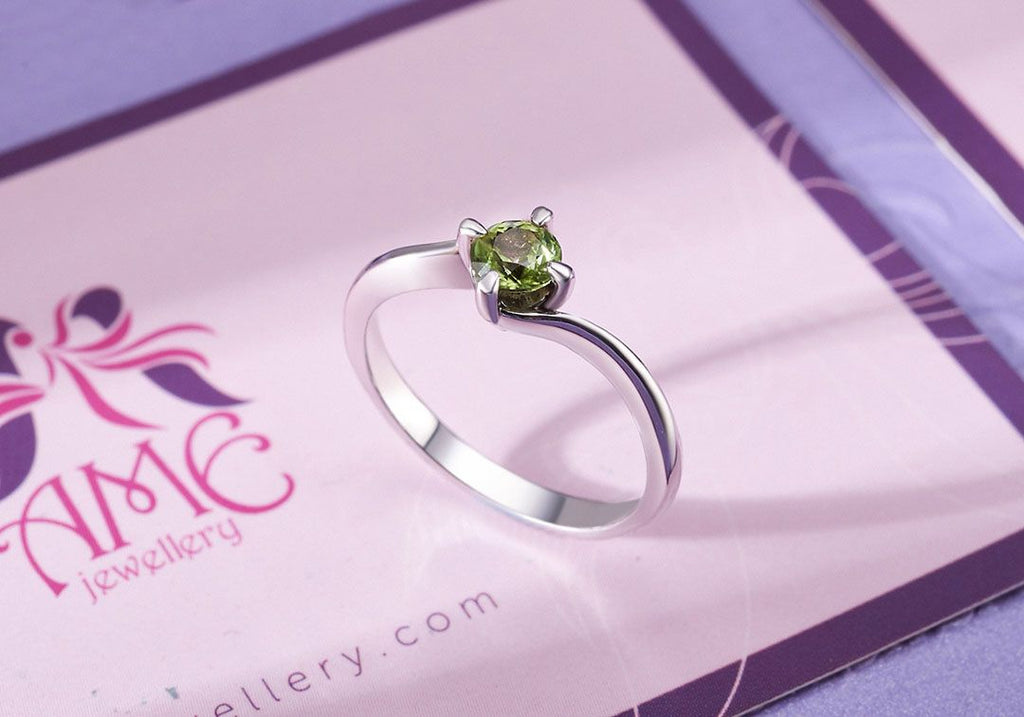 Nhẫn nữ Đá quý thiên nhiên Peridot solitaire twist ring in sterling silver by AME Jewellery